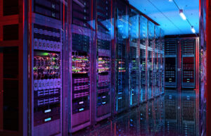 Data center server room lit in purple and blue.